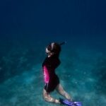 Snorkeling - Woman in Black and Pink Swimsuit Underwater